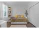 Bright bedroom with a daybed, built-in bookcase, wood floors, and a closet at 1232 Turnbridge Pl, Oviedo, FL 32765