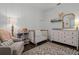 Bedroom features a crib, dresser, decor, gray armchair, and rug at 1232 Turnbridge Pl, Oviedo, FL 32765