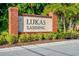 Brick sign with stone insert that reads Lukas Landing with shrubs in front of the sign at 1232 Turnbridge Pl, Oviedo, FL 32765