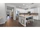 Spacious kitchen with white cabinets, granite countertops, stainless steel appliances, and a central island with seating at 1232 Turnbridge Pl, Oviedo, FL 32765