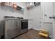 Laundry room with stainless steel appliances, utility sink, and storage at 1232 Turnbridge Pl, Oviedo, FL 32765