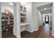 Pantry with wine storage, built-in shelving, and easy access from a beautifully appointed kitchen at 1232 Turnbridge Pl, Oviedo, FL 32765