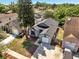 Aerial view of the house highlighting its roof, driveway, and surrounding neighborhood at 1240 Pin Oak Dr, Apopka, FL 32703