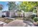 Fenced backyard featuring a shed, lush plants, and grass area with potential for gardening at 1240 Pin Oak Dr, Apopka, FL 32703