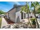 View of the backyard with a sliding glass door, small patio, and well-maintained landscaping at 1240 Pin Oak Dr, Apopka, FL 32703
