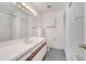 Bright bathroom featuring an extended vanity, white cabinets, and shower-tub combination at 1240 Pin Oak Dr, Apopka, FL 32703