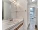Simple bathroom featuring a white vanity, sink, and mirror at 1240 Pin Oak Dr, Apopka, FL 32703