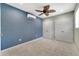 Bedroom featuring a modern ceiling fan and dual closets for storage at 1240 Pin Oak Dr, Apopka, FL 32703