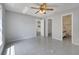 Bright bedroom featuring tile floors, neutral paint, and access to the bathroom at 1240 Pin Oak Dr, Apopka, FL 32703