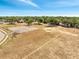 Large community field with a basketball court, ample space for outdoor activities, and surrounding trees at 1240 Pin Oak Dr, Apopka, FL 32703