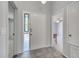 Bright foyer with gray tile flooring, decorative glass, and neutral paint at 1240 Pin Oak Dr, Apopka, FL 32703