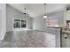 Bright living room featuring gray tile flooring and a view of the patio at 1240 Pin Oak Dr, Apopka, FL 32703