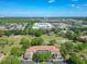 Scenic aerial view of a condominium surrounded by lush greenery and community features at 13839 Fairway Island Dr # 1116, Orlando, FL 32837