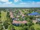 Beautiful aerial shot of a condominium complex nestled within a lush, green landscape near a lake at 13839 Fairway Island Dr # 1116, Orlando, FL 32837
