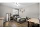 Cozy bedroom with a single bed, desk and hardwood flooring at 13839 Fairway Island Dr # 1116, Orlando, FL 32837