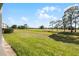 Lush green golf course under a bright blue sky with fluffy white clouds at 13839 Fairway Island Dr # 1116, Orlando, FL 32837