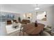 Well-lit living room featuring modern decor, hardwood floors and a sliding glass door with natural light at 13839 Fairway Island Dr # 1116, Orlando, FL 32837