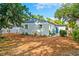 Backyard featuring mature trees, a fenced yard, and lush landscaping perfect for outdoor activities at 1421 N Hampton Ave, Orlando, FL 32803