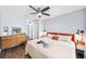 Spacious bedroom with hardwood floors, ceiling fan, and a modern dresser at 1421 N Hampton Ave, Orlando, FL 32803