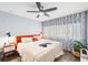 Cozy bedroom with ceiling fan, a large window, and ample natural light at 1421 N Hampton Ave, Orlando, FL 32803