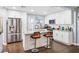 Bright kitchen featuring white cabinetry, granite countertops, and stainless steel appliances at 1421 N Hampton Ave, Orlando, FL 32803