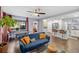 Open concept living room and kitchen with hardwood floors and modern appliances at 1421 N Hampton Ave, Orlando, FL 32803