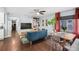 Open-concept living room featuring a modern decor, hardwood floors, and natural light at 1421 N Hampton Ave, Orlando, FL 32803