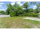 Spacious backyard with vinyl fence and small concrete slab perfect for outdoor enjoyment and privacy at 14878 Se 32Nd Ter, Summerfield, FL 34491