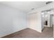 A comfortable bedroom with neutral walls, and easy access to the bathroom and closet at 14878 Se 32Nd Ter, Summerfield, FL 34491