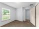 The bedroom provides ample space, with a window and closet, perfect for comfortable living at 14878 Se 32Nd Ter, Summerfield, FL 34491