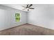 A well-lit bedroom features a window, providing natural light and a view of the outdoors at 14878 Se 32Nd Ter, Summerfield, FL 34491