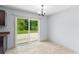 Cozy dining area with tiled floors and a sliding glass door to the outdoor patio at 14878 Se 32Nd Ter, Summerfield, FL 34491