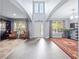 Spacious, light-filled foyer with soaring ceilings, gray tile floors, and elegant decor at 15242 Heron Hideaway Cir, Winter Garden, FL 34787