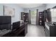 Home office featuring a desk, bookshelves, and natural light at 15242 Heron Hideaway Cir, Winter Garden, FL 34787