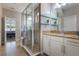 Spacious bathroom features a glass shower, granite countertop, dual sinks, and neutral colors at 15443 Sugarcup Ct, Orlando, FL 32828