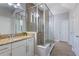 Bathroom with granite counters, glass shower, and tiled floors at 15443 Sugarcup Ct, Orlando, FL 32828