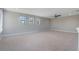 Spacious carpeted bedroom with three windows and a ceiling fan at 15443 Sugarcup Ct, Orlando, FL 32828