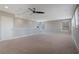 Large carpeted bedroom features a ceiling fan and natural lighting at 15443 Sugarcup Ct, Orlando, FL 32828