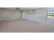 Spacious carpeted bedroom with ceiling fan and natural lighting at 15443 Sugarcup Ct, Orlando, FL 32828