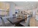 Open concept dining room and kitchen with a table with four chairs and dark finish at 15443 Sugarcup Ct, Orlando, FL 32828