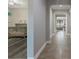 Inviting interior hallway with tiled floors, archways and a Bedroom on the left at 15443 Sugarcup Ct, Orlando, FL 32828