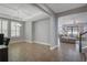 Open-concept living space features a coffered ceiling, tile flooring, and a view into the living room at 15443 Sugarcup Ct, Orlando, FL 32828
