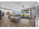 Bright open-concept living room that combines a stylish living space and a modern kitchen at 15443 Sugarcup Ct, Orlando, FL 32828