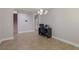 Home office with desk area featuring computer, chair, adjacent to staircase, and overhead lighting at 15443 Sugarcup Ct, Orlando, FL 32828