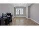Bright office with tile flooring, neutral paint, and white blinds providing ample natural light at 15443 Sugarcup Ct, Orlando, FL 32828