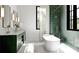 Modern bathroom featuring a soaking tub, a glass-enclosed shower, and a stylish vanity at 185 Sylvan Blvd, Winter Park, FL 32789