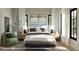 Serene bedroom with a tufted headboard, neutral color palette, and plenty of natural light at 185 Sylvan Blvd, Winter Park, FL 32789