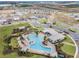 Aerial view of community amenities, pool, clubhouse, and scenic landscaping at 1880 Perch Hammock Loop, Groveland, FL 34736