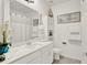 Bright bathroom featuring modern vanity, storage, and coastal decor at 1880 Perch Hammock Loop, Groveland, FL 34736