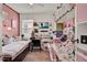 Bright bedroom features a bed, desk, shelving, and creative decor at 1880 Perch Hammock Loop, Groveland, FL 34736